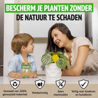 Mutter und Kind an einer Zimmerpflanze mit Gelbtafel